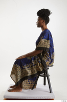  Dina Moses  1 dressed sitting traditional decora long african dress whole body 0001.jpg